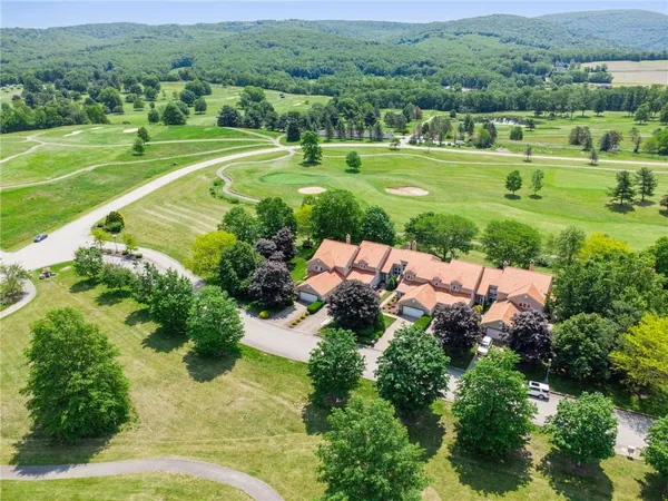 an aerial view of a golf course with a yard