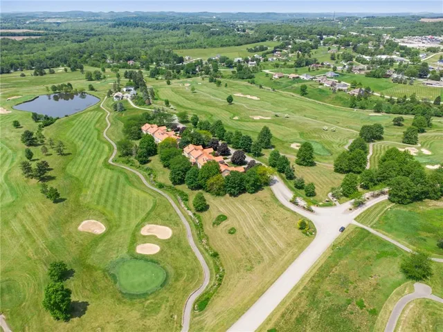 a view of a swimming pool with a yard