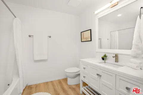 a bathroom with a sink toilet and vanity