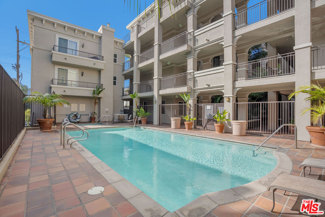 4060 Glencoe Avenue, Unit 228 Marina del Rey, CA 90292 - Photo 13 of 18 a view of a building with a patio