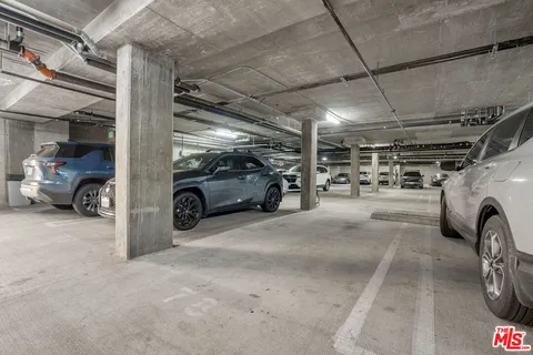 a view of parking garage with cars