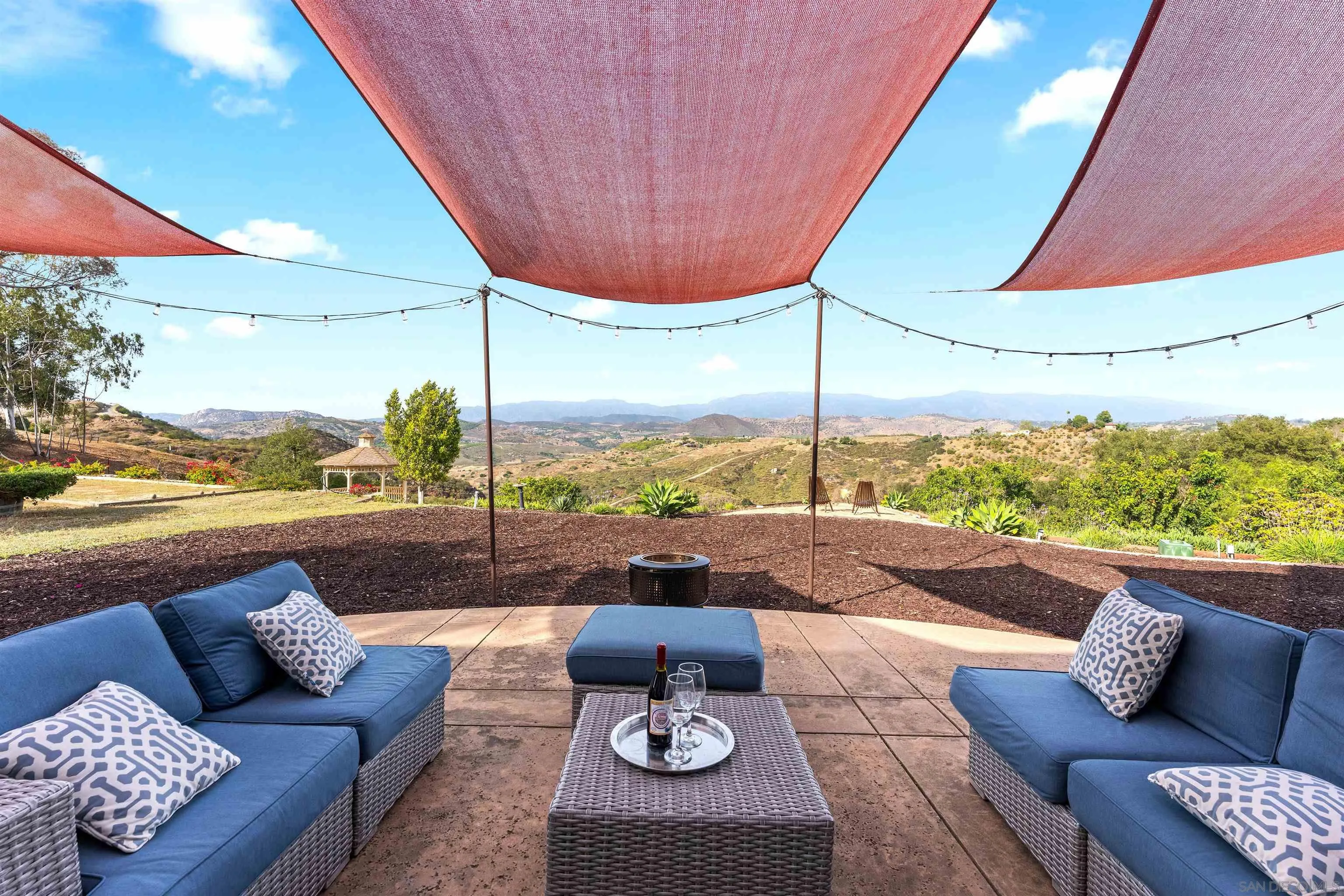 30659 Diaz Road Valley Center, CA 92082 - Photo 11 of 44 a view of a patio with couches and a table and chairs