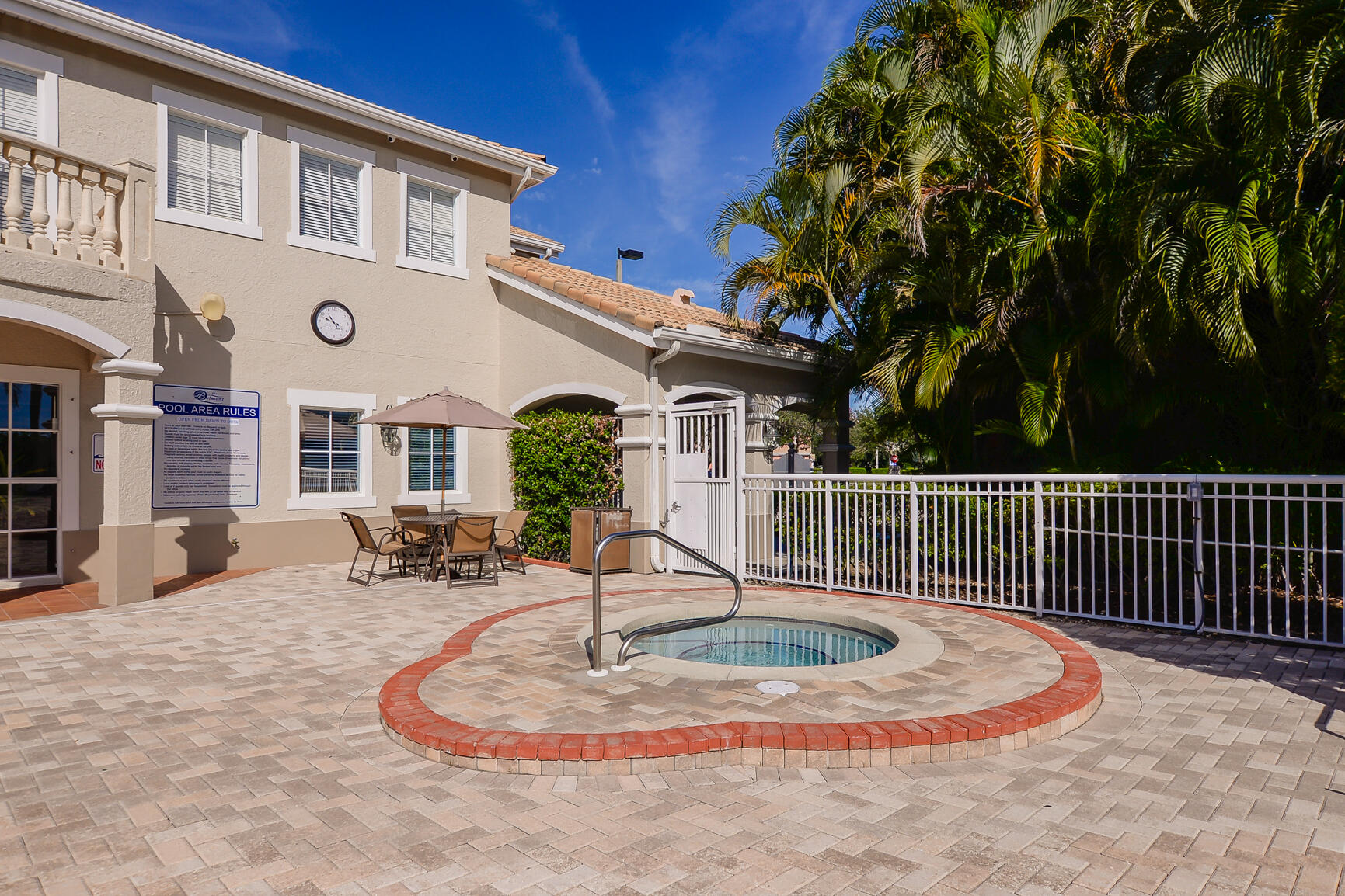 106 Southwest Peacock Boulevard, Unit 4204 Port St. Lucie, FL 34986 - Photo 33 of 46 a view of a house with backyard porch and sitting area