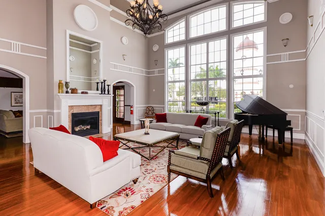 a living room with furniture a table and a fireplace