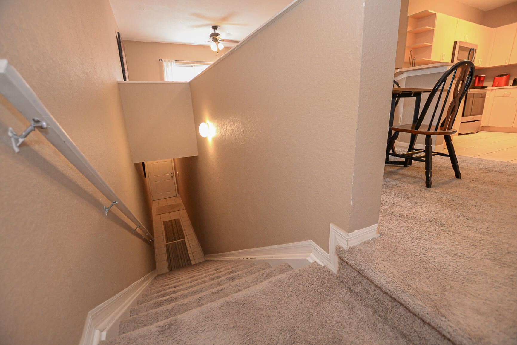 106 Southwest Peacock Boulevard, Unit 4204 Port St. Lucie, FL 34986 - Photo 8 of 46 a view of a livingroom with wooden floor and furniture