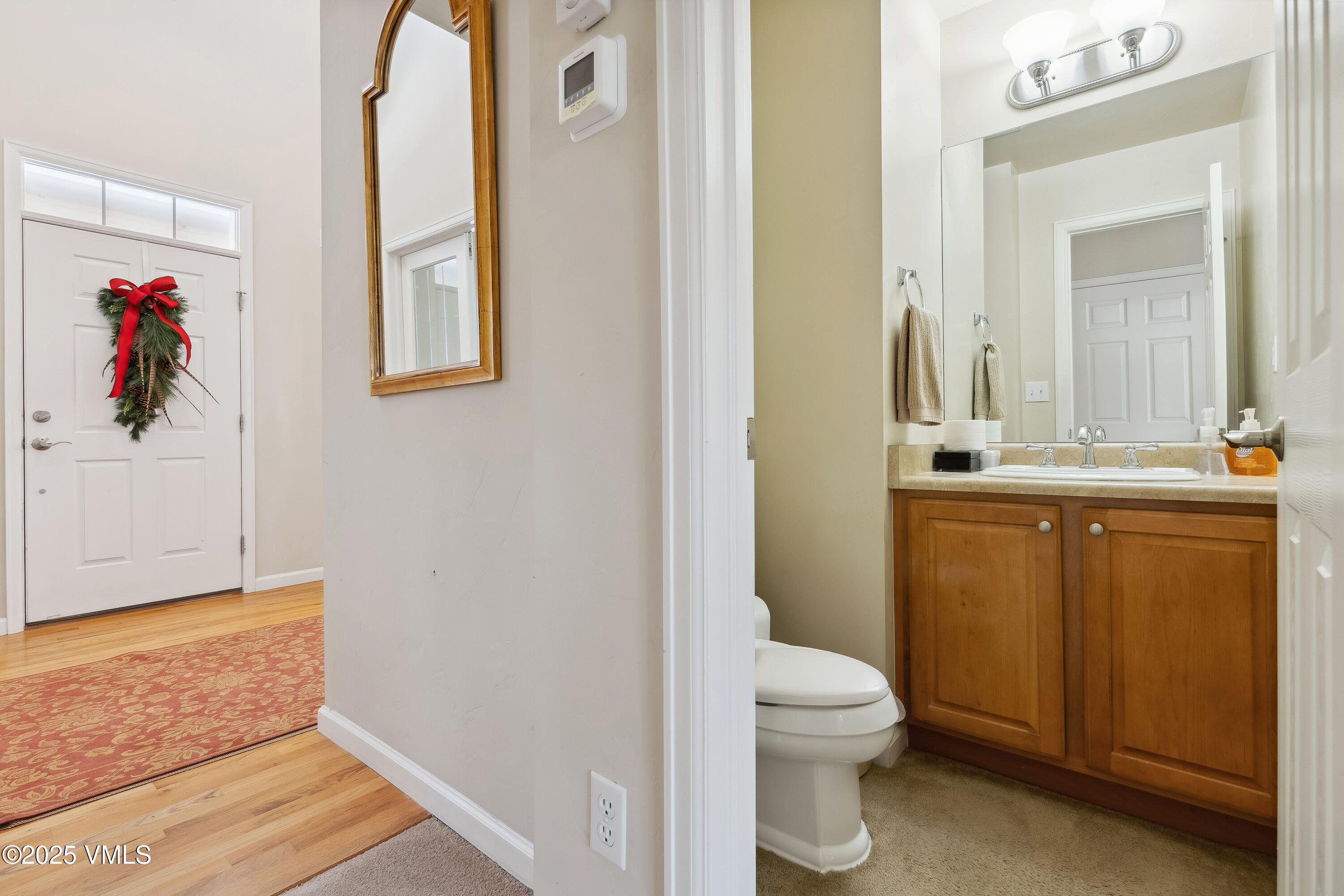 206 Mayer Street Eagle, CO 81631 - Photo 16 of 38 a bathroom with a toilet sink and mirror