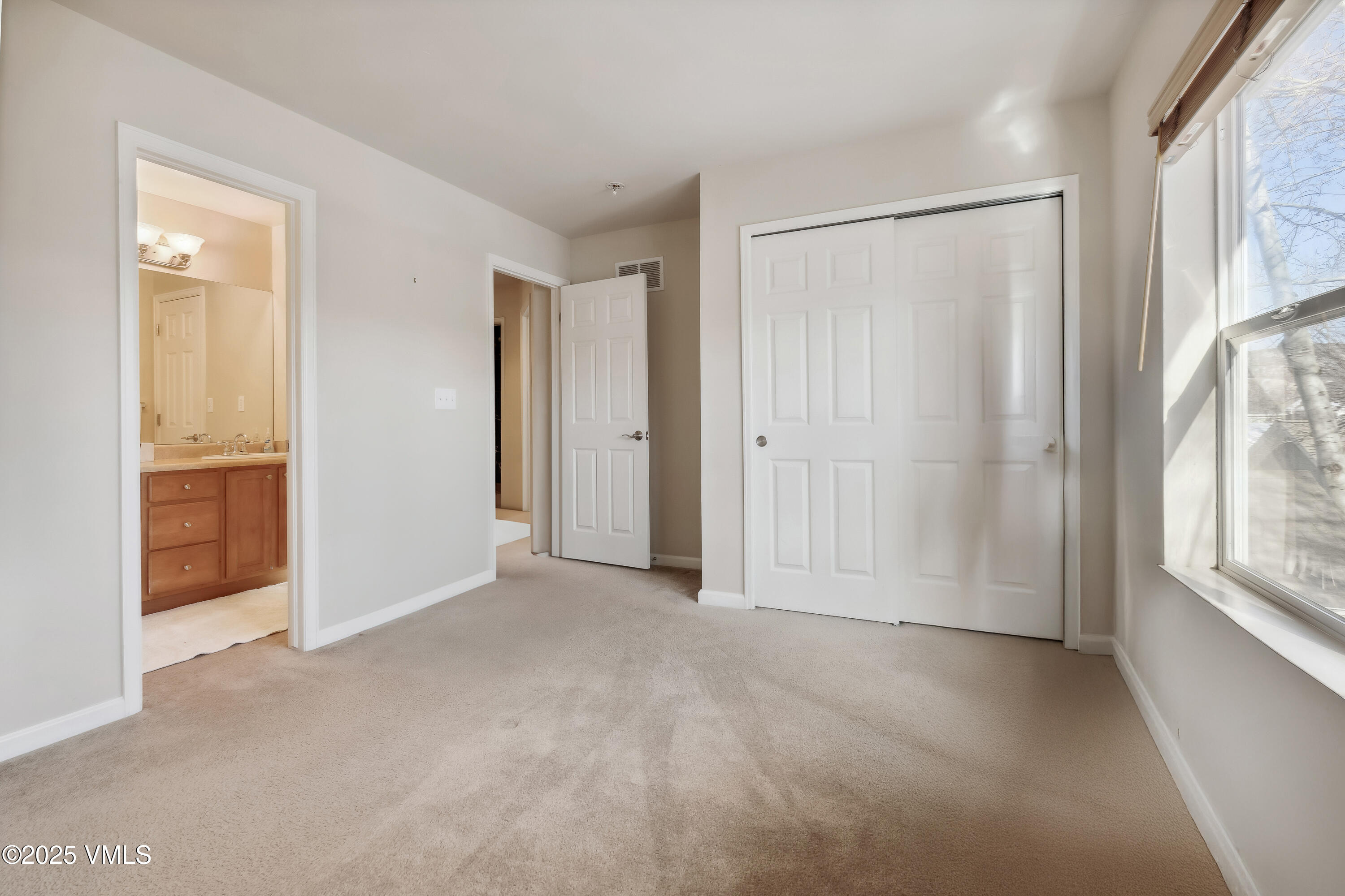 206 Mayer Street Eagle, CO 81631 - Photo 20 of 38 a view of an empty room with a window