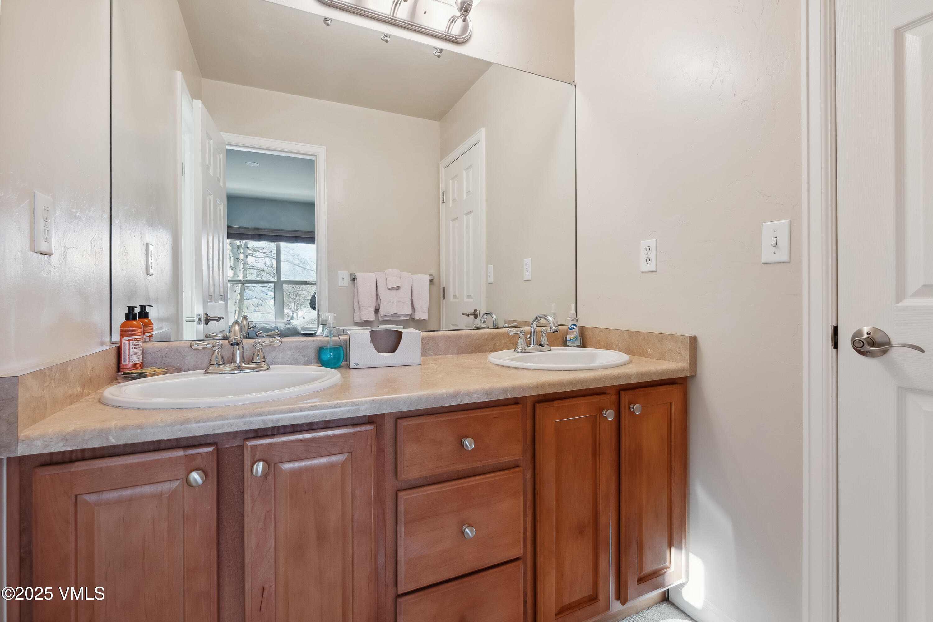 206 Mayer Street Eagle, CO 81631 - Photo 27 of 38 a bathroom with a double vanity sink and a mirror