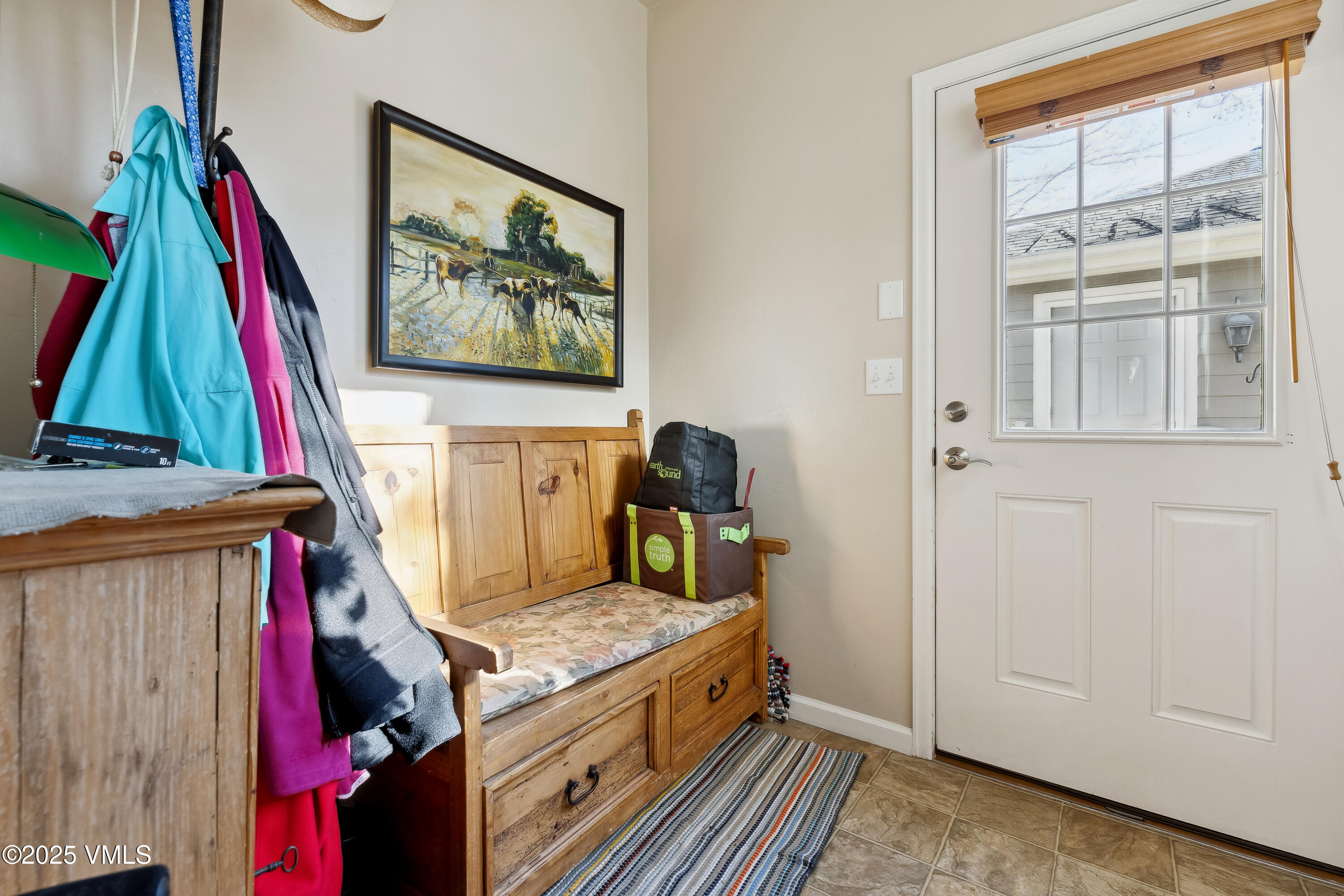 206 Mayer Street Eagle, CO 81631 - Photo 29 of 38 a bed room with a bed and a painting on the wall