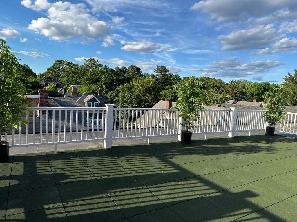 632 Centre Street, Unit 304 Boston, MA 02130 - Photo 10 of 15 a view of a deck with a yard