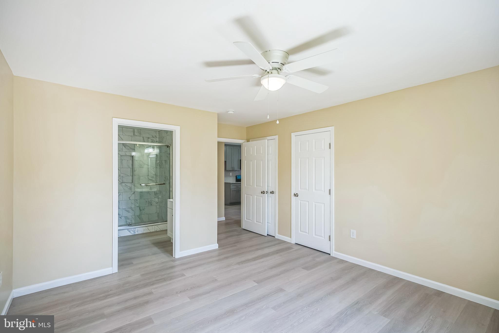 208 Hooker Street Riverside, NJ 08075 - Photo 13 of 25 a view of a room with wooden floor and white walls