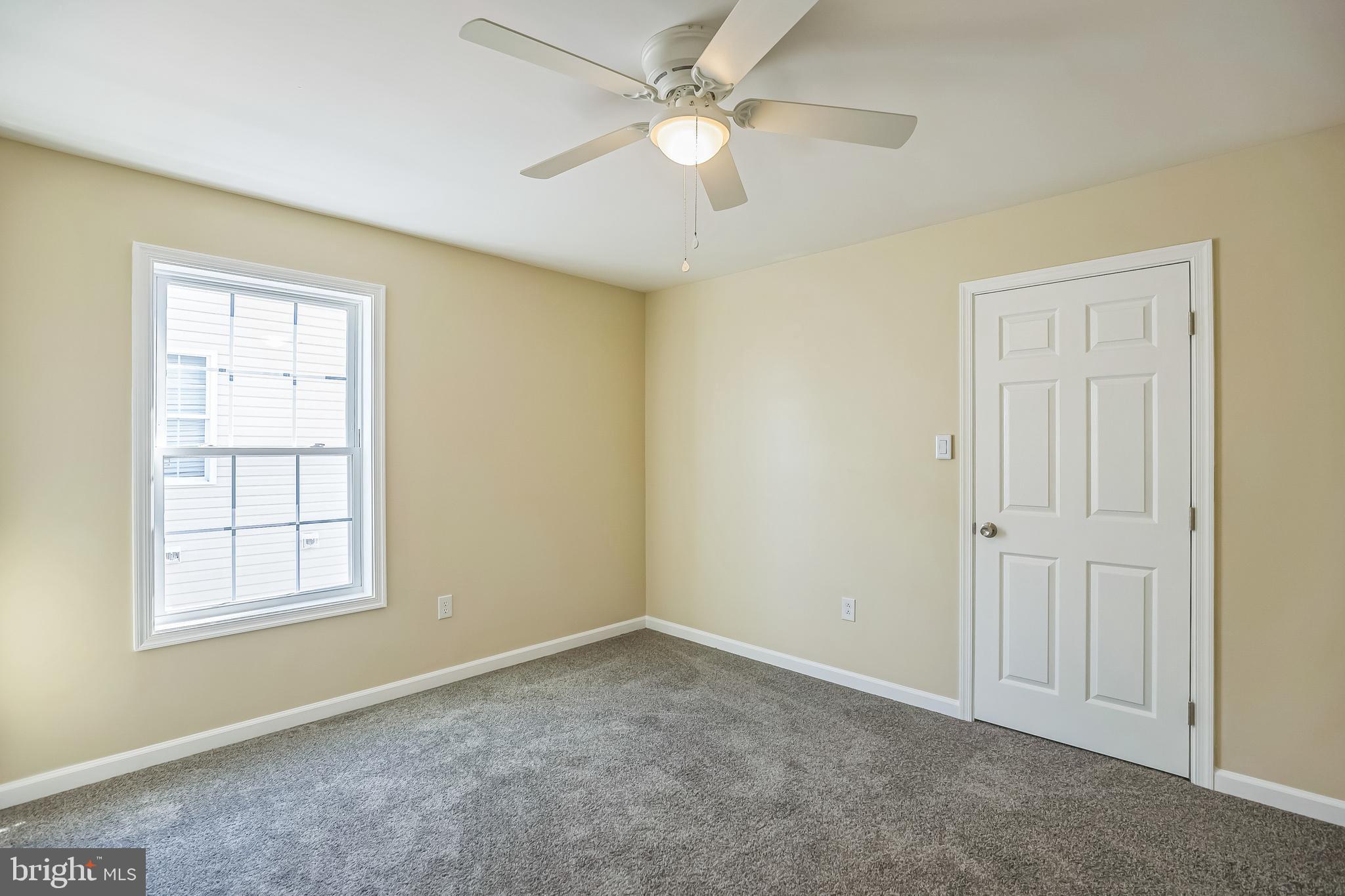 208 Hooker Street Riverside, NJ 08075 - Photo 18 of 25 an empty room with windows and fan