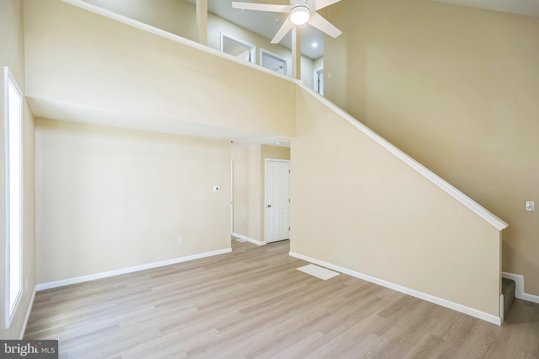 208 Hooker Street Riverside, NJ 08075 - Photo 4 of 25 a view of a big room with wooden floor