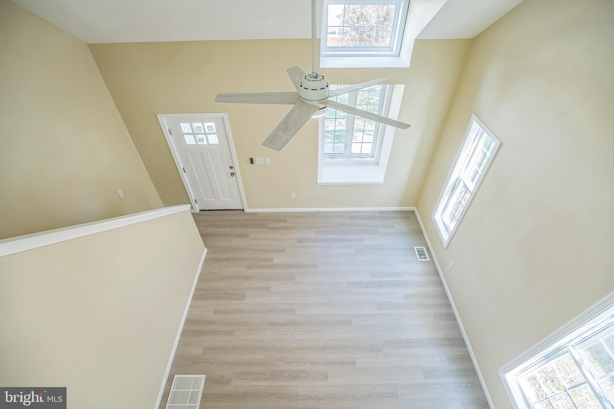 208 Hooker Street Riverside, NJ 08075 - Photo 5 of 25 a view of an entryway with wooden floor and windows