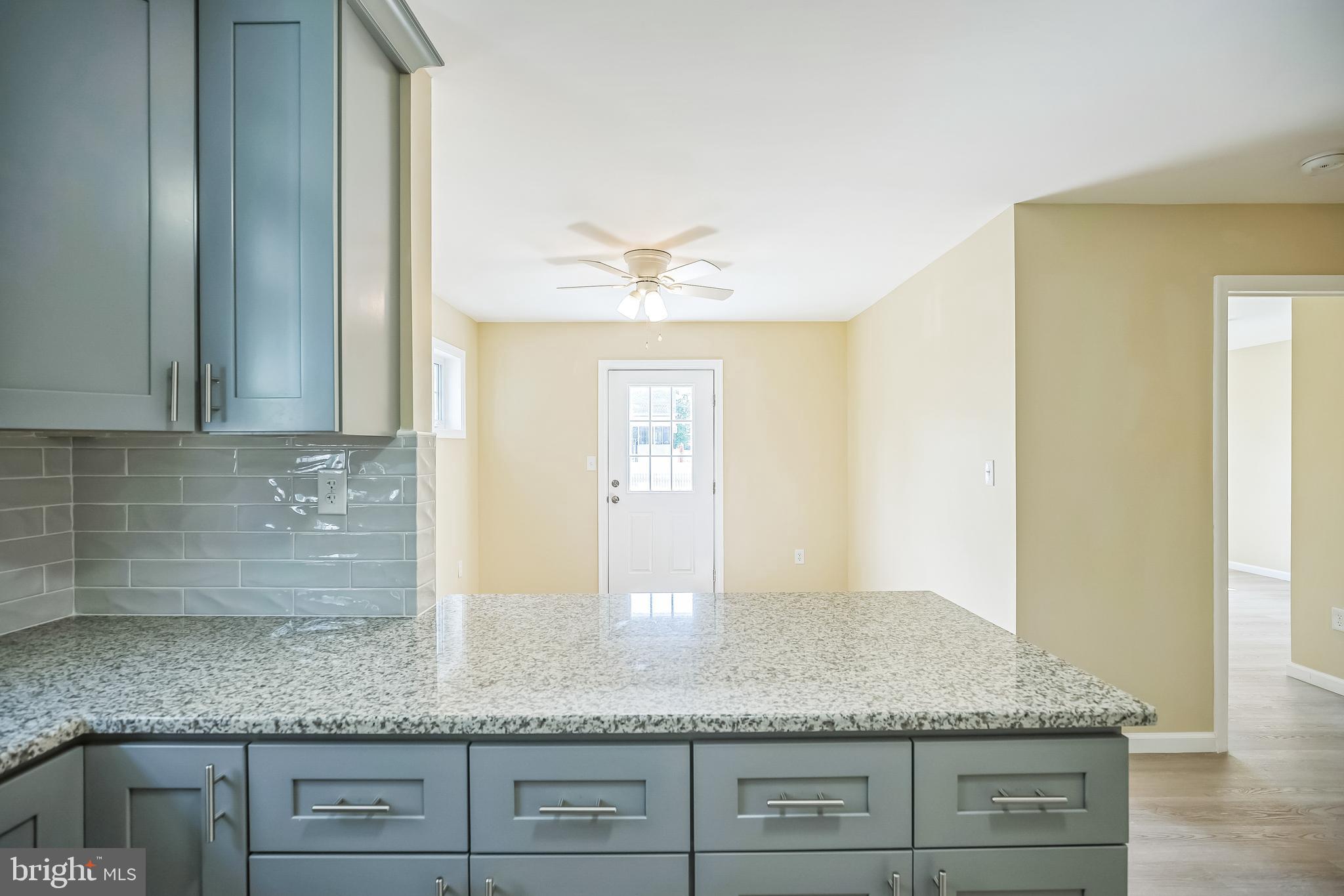 208 Hooker Street Riverside, NJ 08075 - Photo 9 of 25 a bathroom with sink granite and mirror