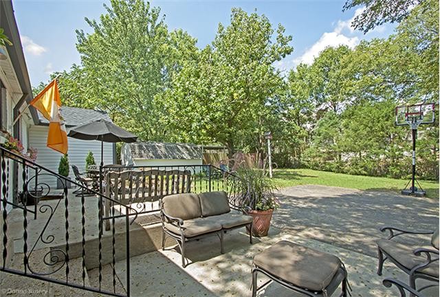 1714 Glen Echo Road Nashville, TN 37215 - Photo 9 of 12 a view of a patio with couches table and chairs and wooden fence
