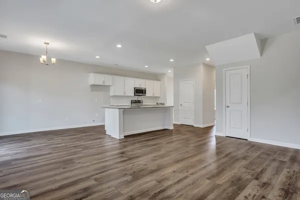a view of kitchen with wooden floor