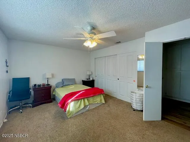 a bathroom with a sink mirror vanity and toilet