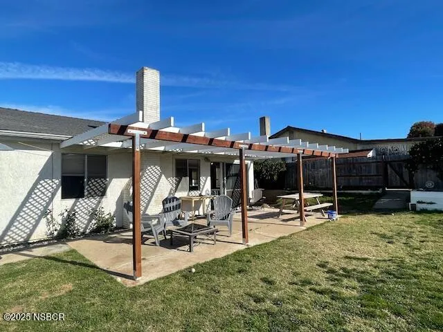 a view of a chairs and table in the ocean