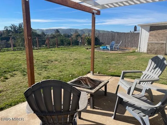 a view of a field with a tree in it