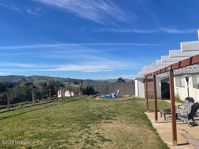 a view of a backyard of the house