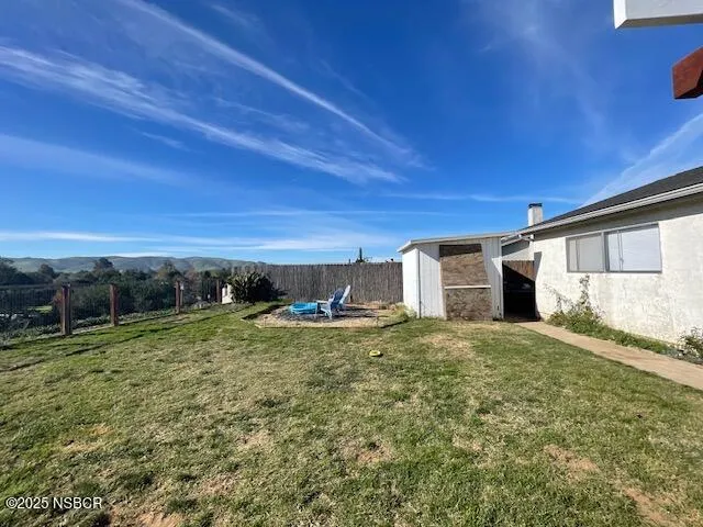 a view of a field with an trees