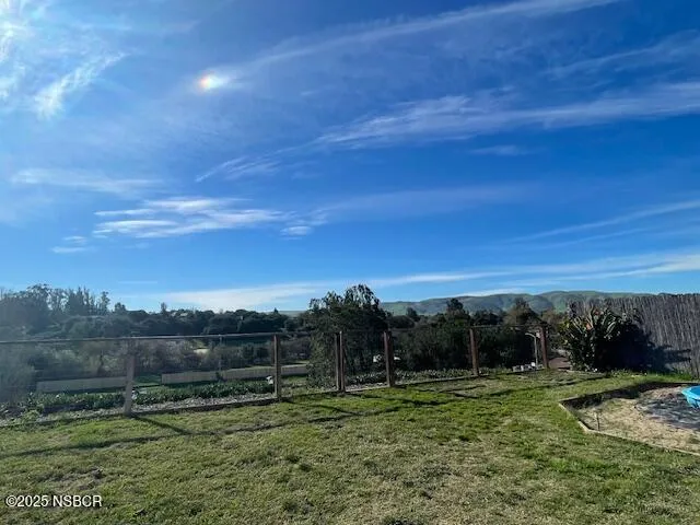 a view of a field with an outdoor space