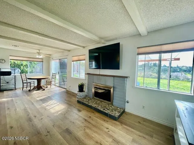 a view of a chairs and table in front of a house