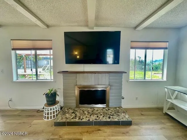 a view of a patio with a table chairs and a backyard