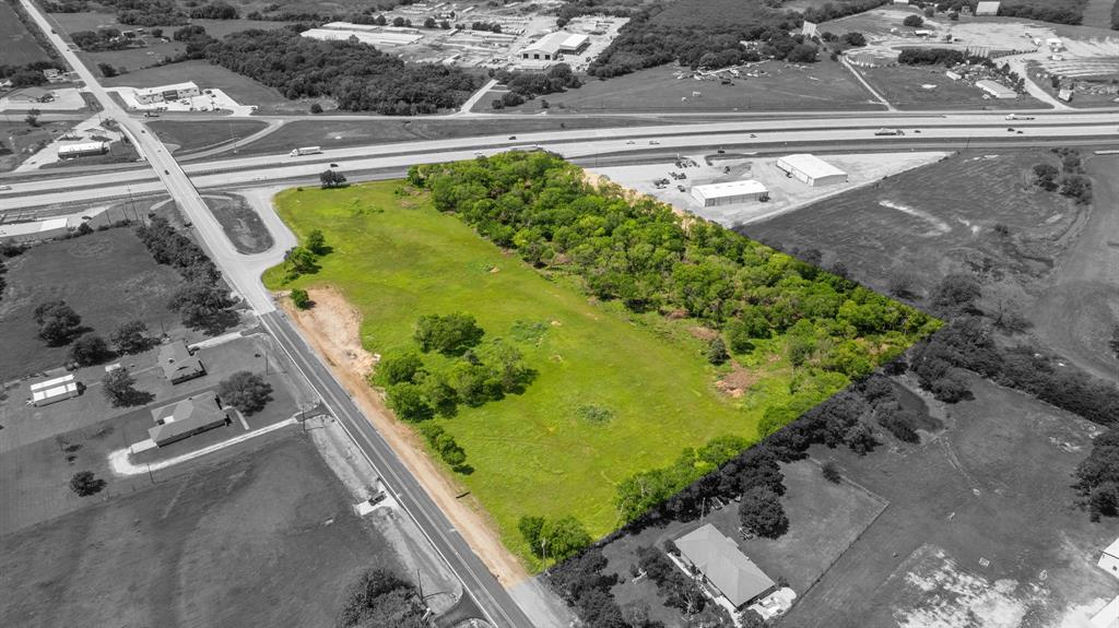 45 North Interstate 45 Ennis, TX 75119 - Photo 11 of 12 Expansive undeveloped parcel featuring a mix of open green space and mature tree cover
