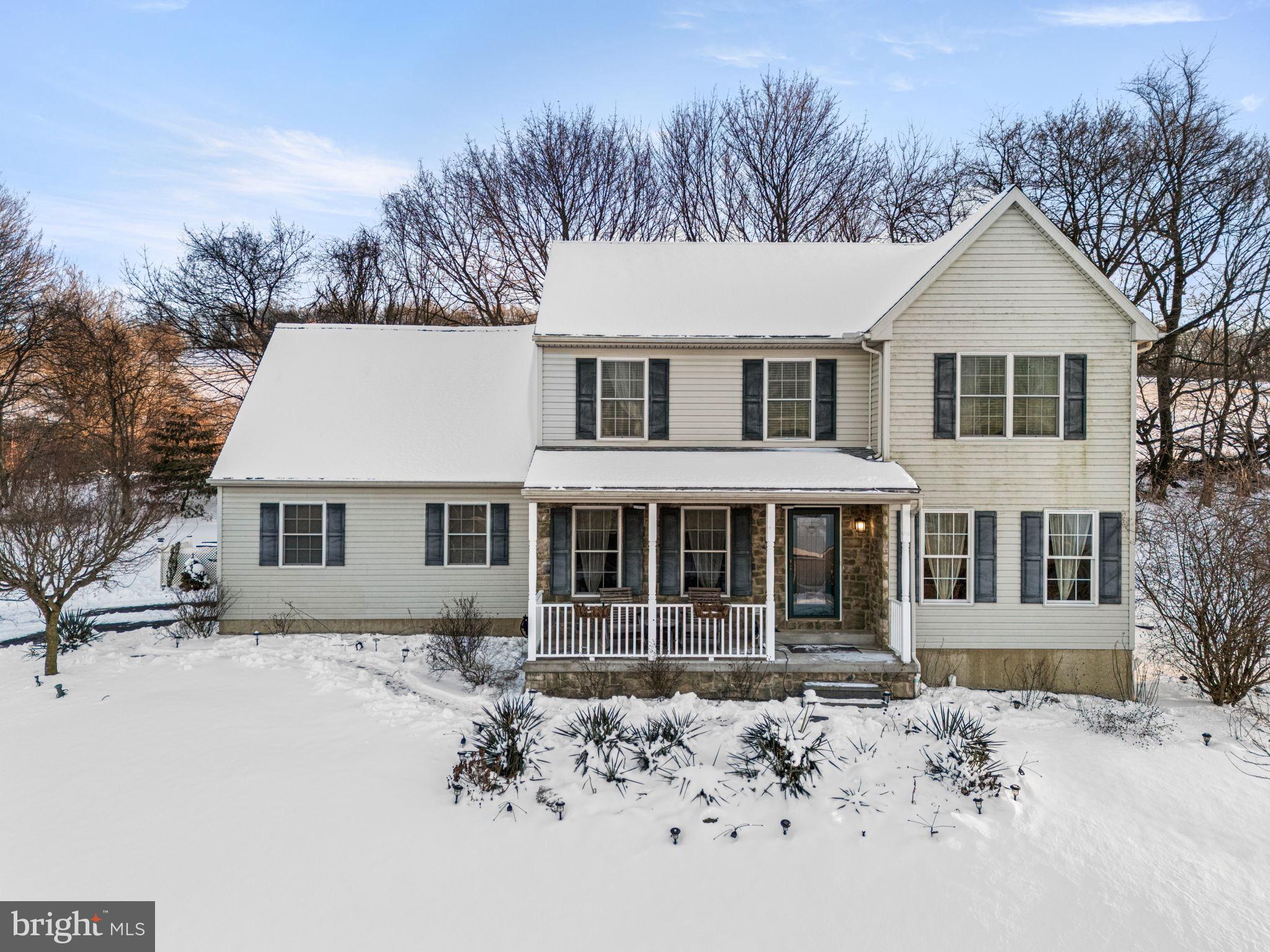 Charming home nestled in a winter wonderland.