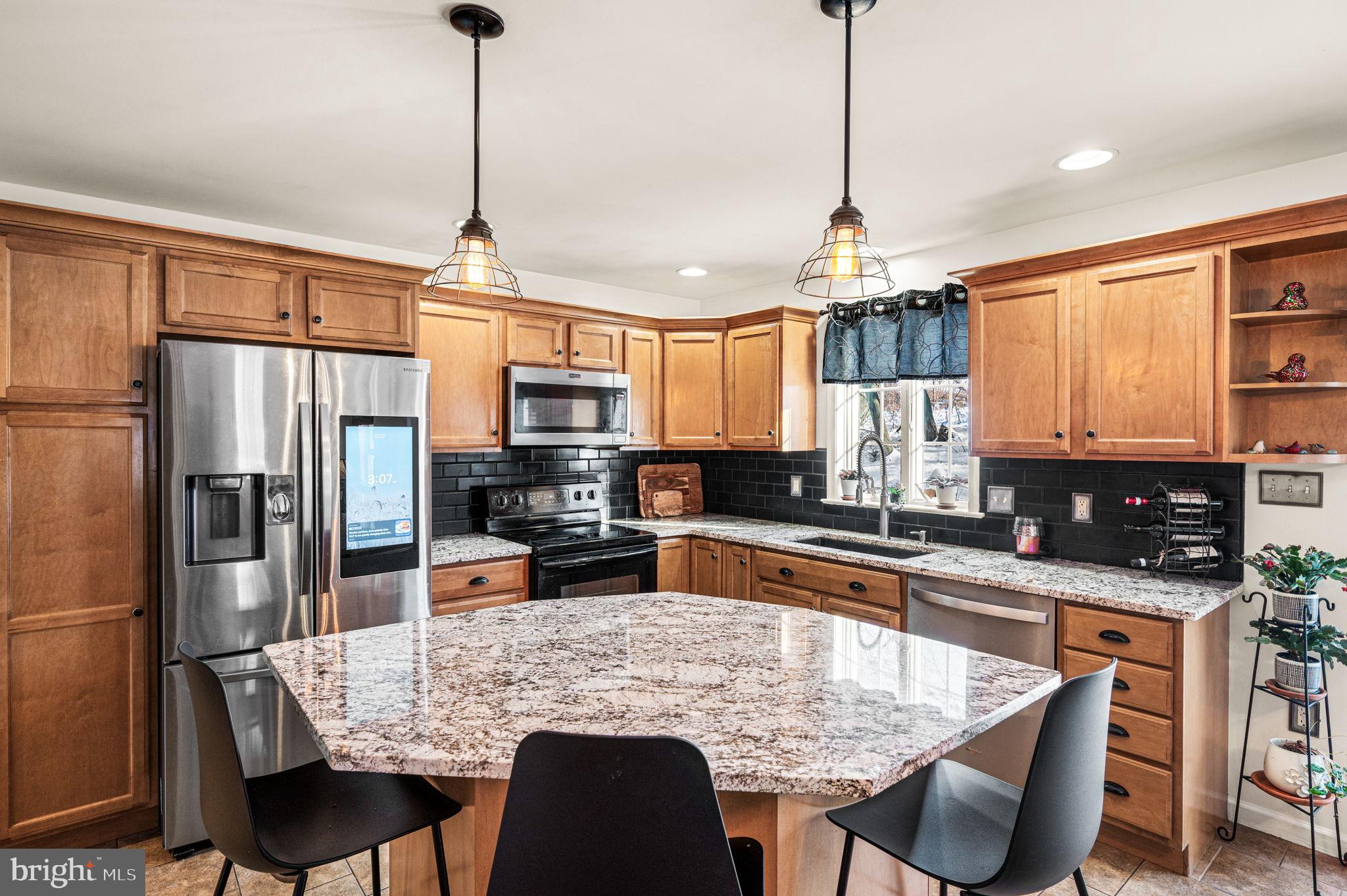 650 Willow Lane Atglen, PA 19310 - Photo 12 of 49 Modern kitchen with elegant wood cabinetry.