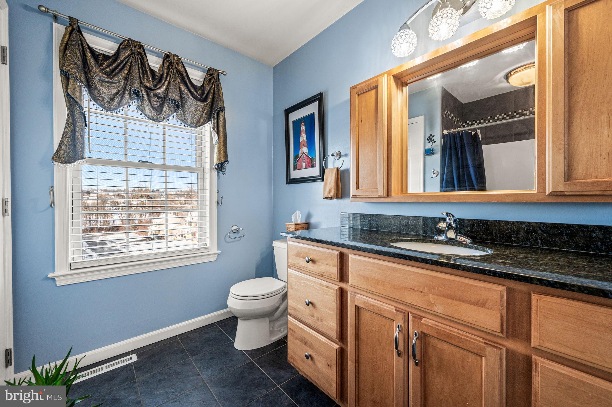 650 Willow Lane Atglen, PA 19310 - Photo 34 of 49 Charming bathroom with serene blue tones.