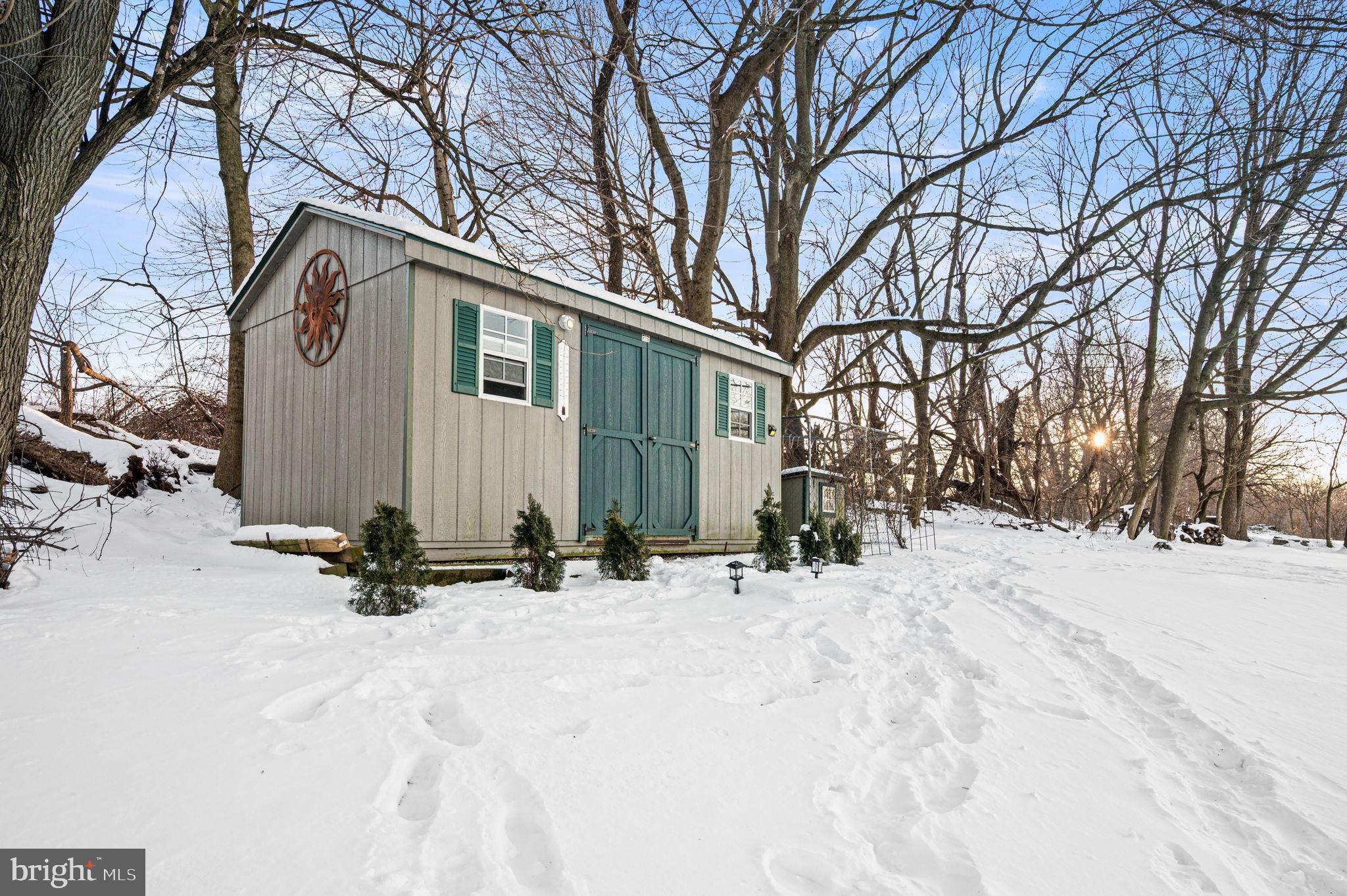 650 Willow Lane Atglen, PA 19310 - Photo 42 of 49 Charming cabin nestled in a snowy landscape.
