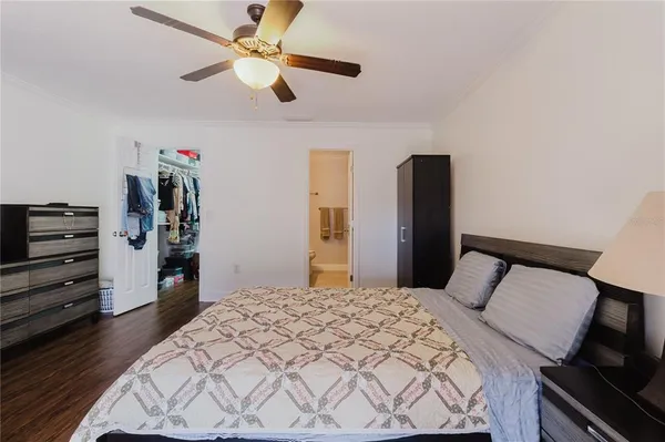 a bedroom with a bed and dresser