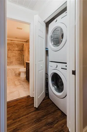 a view of a hallway with washer and dryer