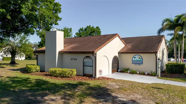 an aerial view of house with yard swimming pool and outdoor seating