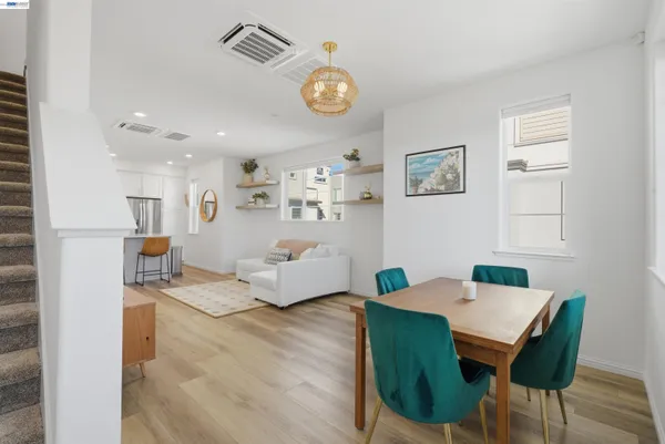 a view of a dining room with furniture and a table