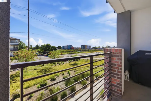 a view of a balcony with an outdoor seating