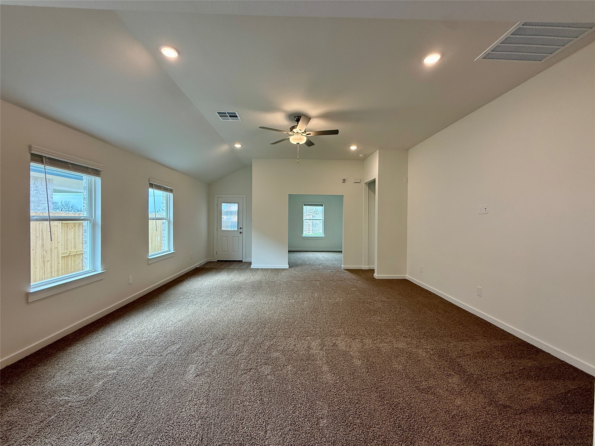 3218 Emerald Hills Drive Angleton, TX 77515 - Photo 6 of 7 a view of a room with windows and ceiling fan