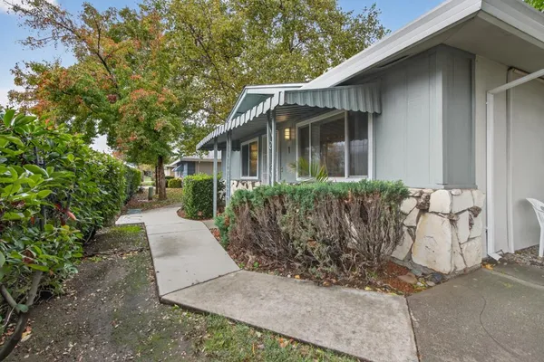 a front view of a house with garden