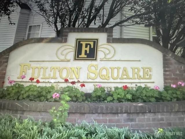 a street sign on the side of a building