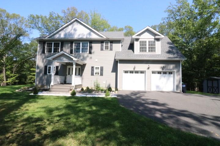 15 Bisch Road Middletown, NY 10940 - Photo 1 of 1 View of front of property featuring a garage, a storage shed, and a front yard
