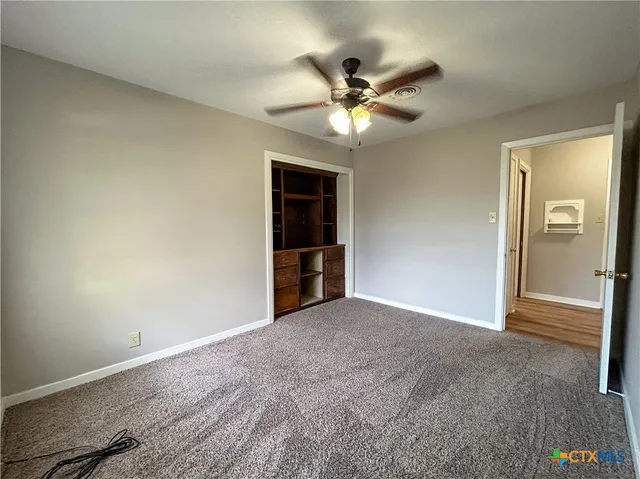 a view of an empty room and window