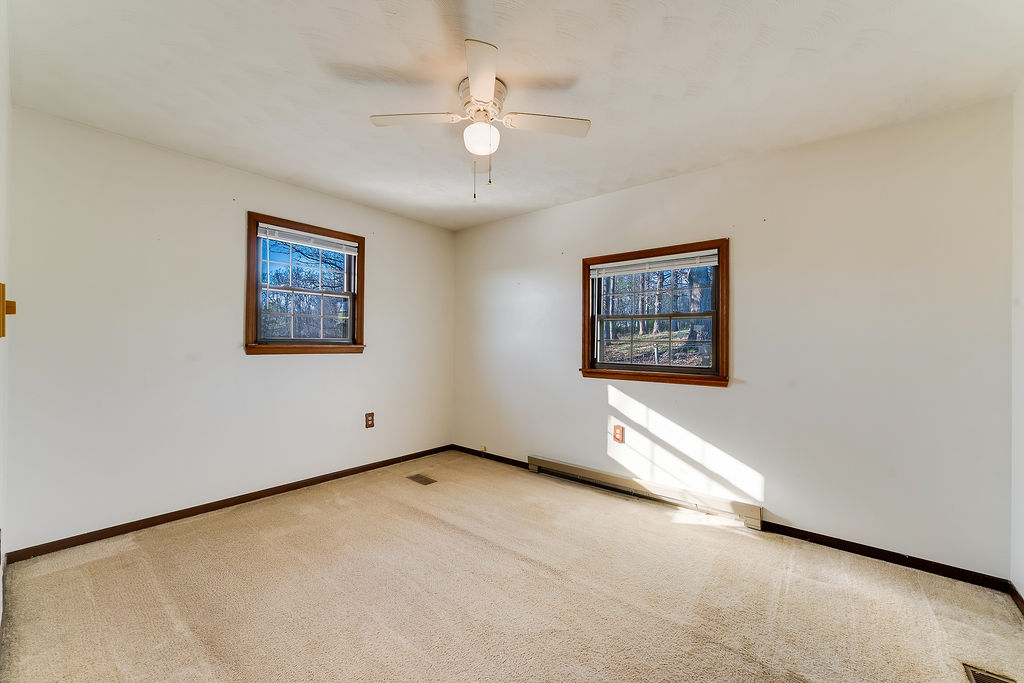 100 Nichols Ridge Road Seaman, OH 45679 - Photo 21 of 43 This bright room features abundant natural light and carpet flooring.