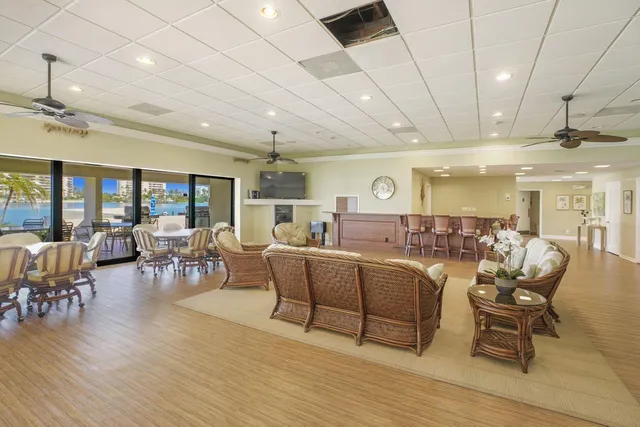a living room with lots of furniture and wooden floors