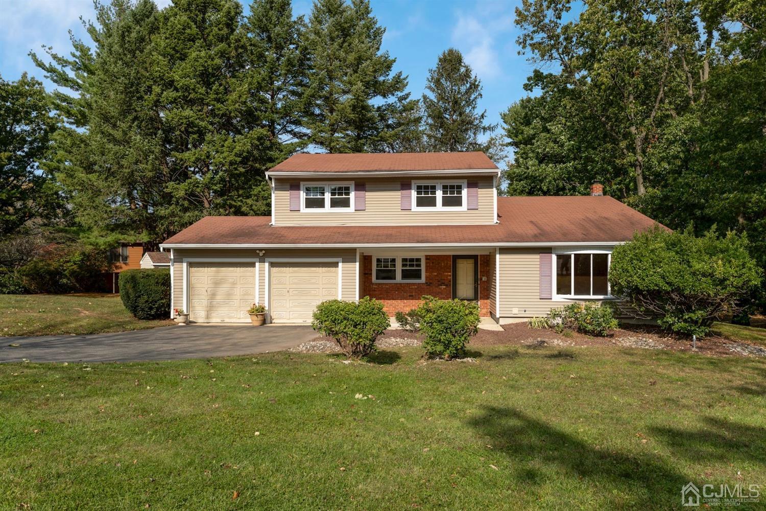 26 Donald Road East Brunswick, NJ 08816 - Photo 1 of 27 a front view of a house with a garden