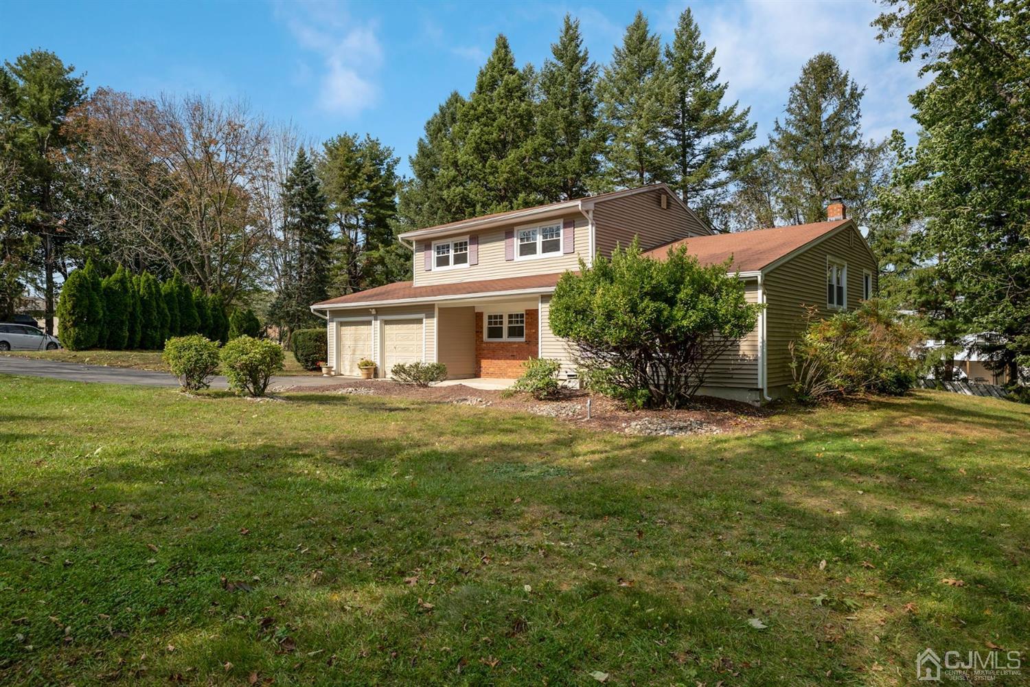 26 Donald Road East Brunswick, NJ 08816 - Photo 2 of 27 a front view of a house with a garden