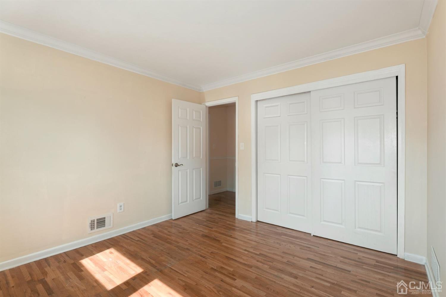 26 Donald Road East Brunswick, NJ 08816 - Photo 17 of 27 a view of an empty room and wooden floor