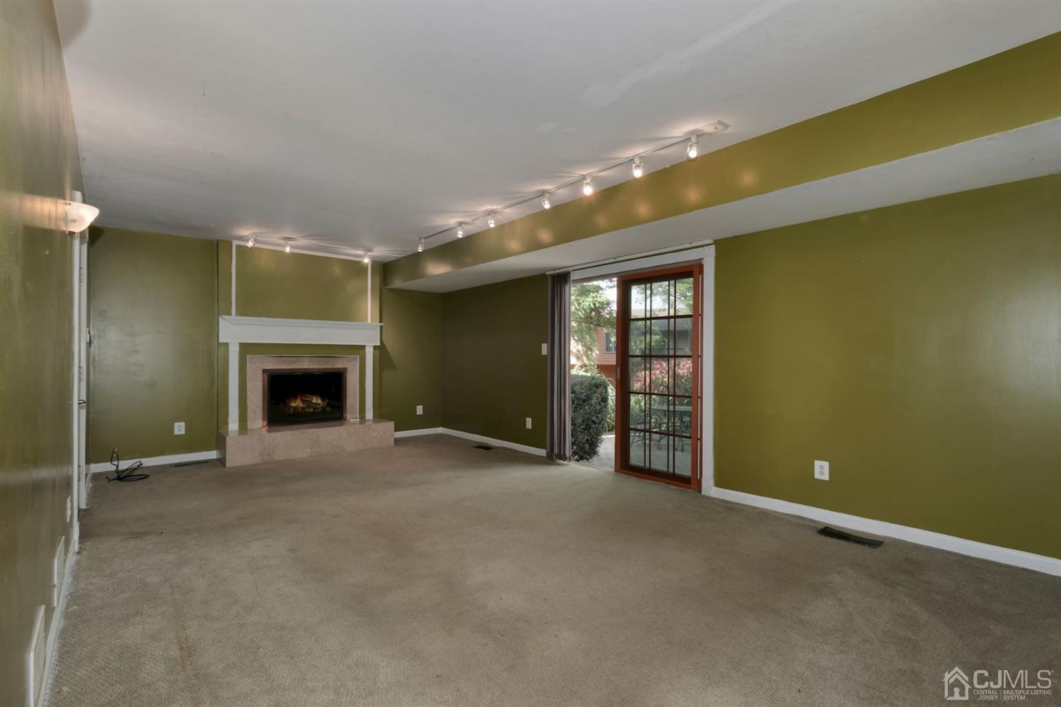 26 Donald Road East Brunswick, NJ 08816 - Photo 21 of 27 a view of an empty room with a fireplace